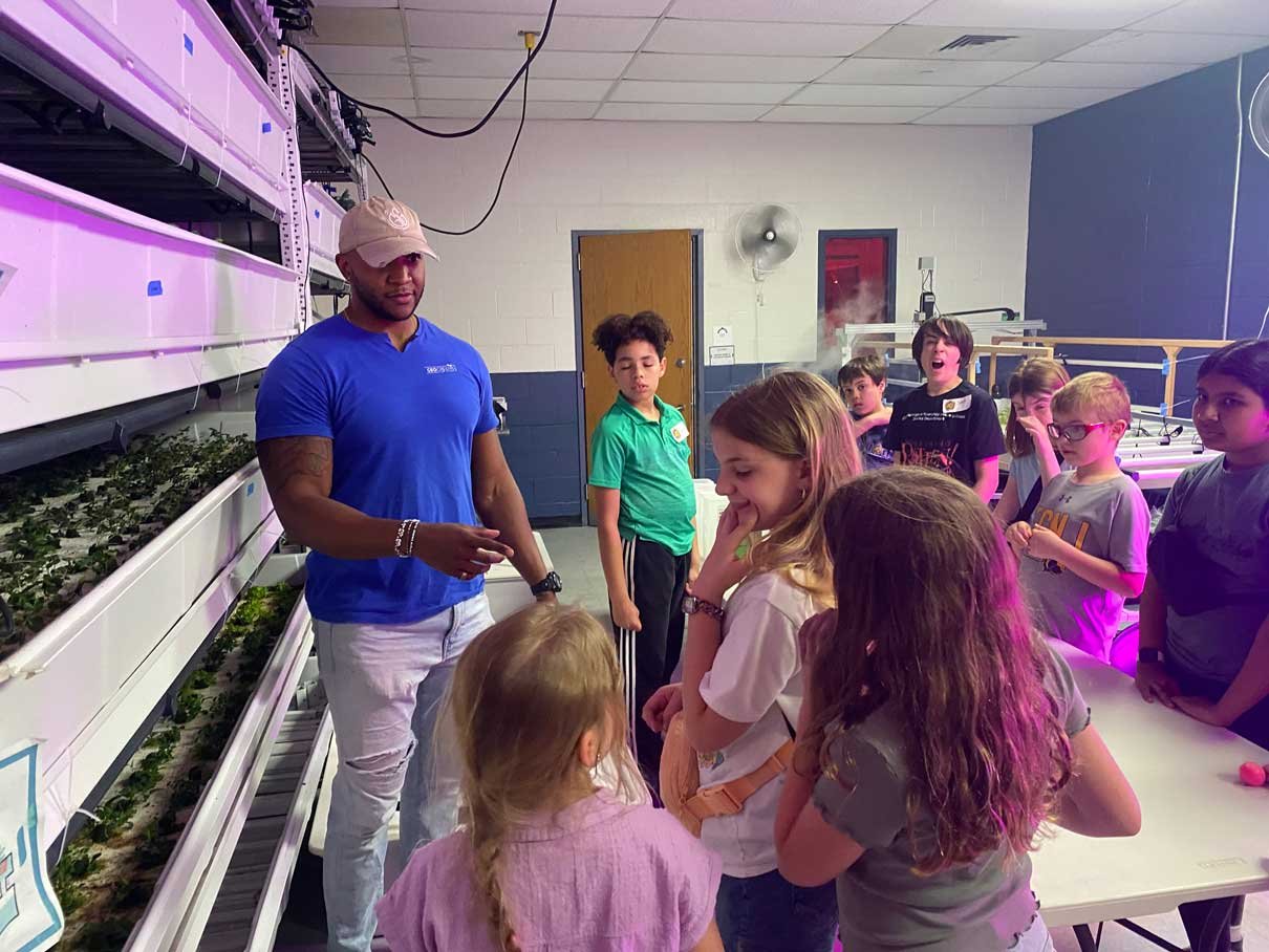 Desmond Hayes introducing visitors to the hydroponic systems at iA Labs