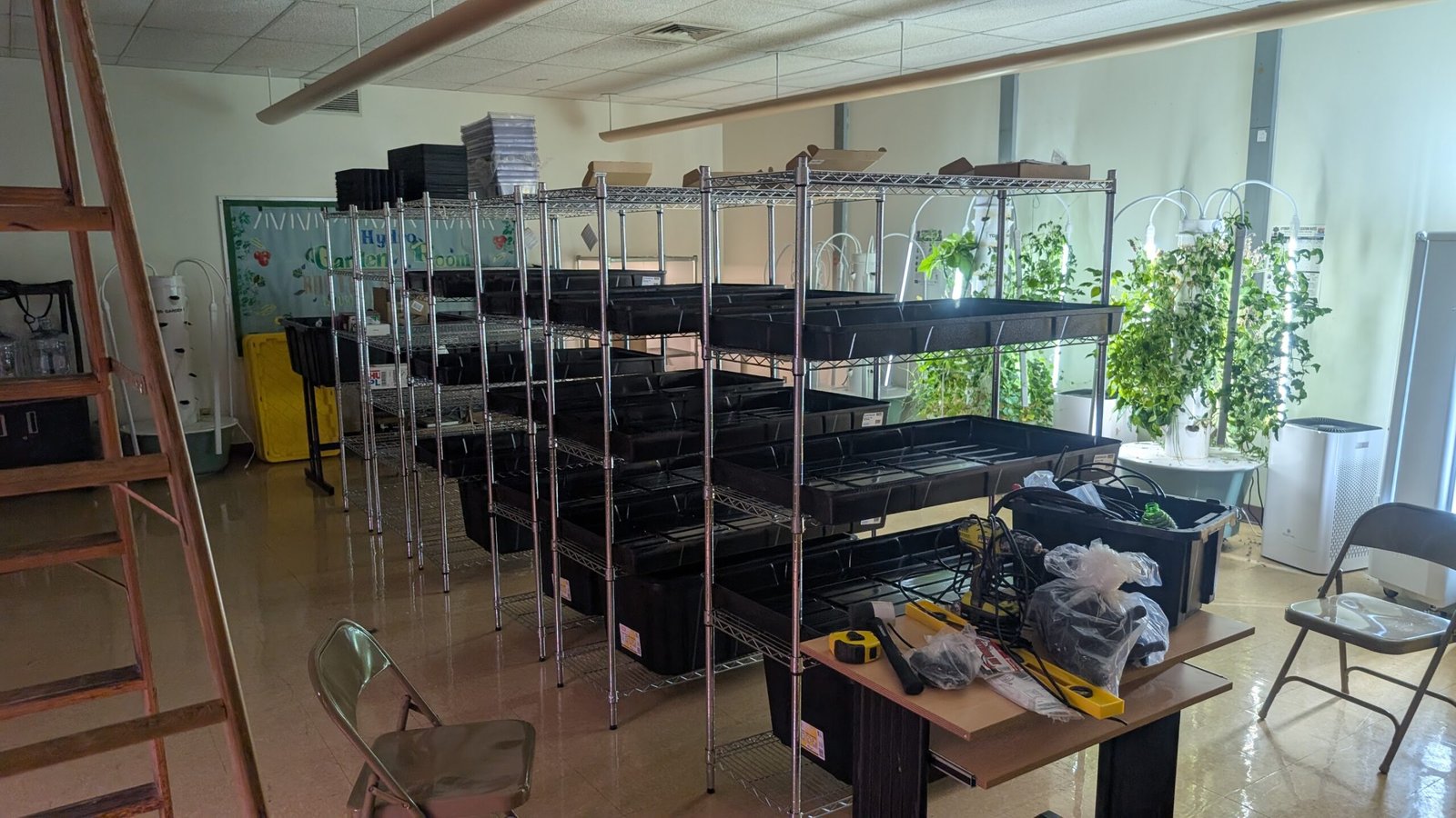 Black growing trays and planted towers at Copewood